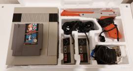 For sale Nintendo NES console with 2 controllers and gun, USD 150