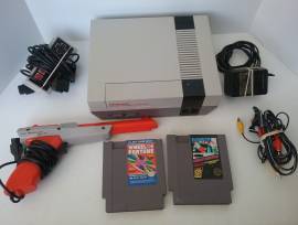 For sale Nintendo NES console + cables + controller + gun and games, USD 150