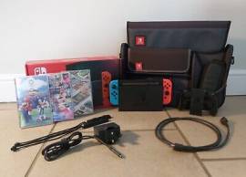 For sale Nintendo Switch console pack, accessories + game + bag, USD 325