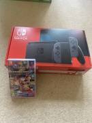 Sell Nintendo Switch V2 console, Gray Joy-Con and MarioKart Deluxe8, USD 195