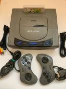 For sale gray Sega Saturn console with 2 controls, USD 195