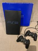 For sale PS2 console with 2 controls, 2 memory cards and 12 games, € 95